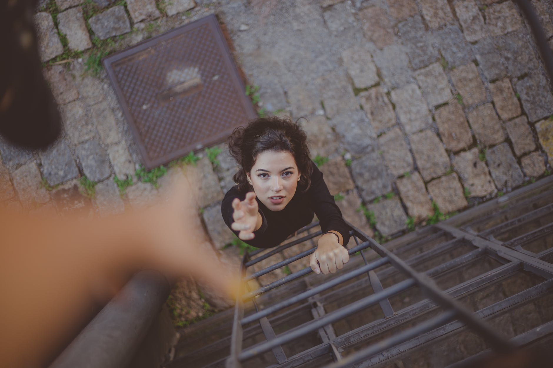 high angle photo of woman on ladder